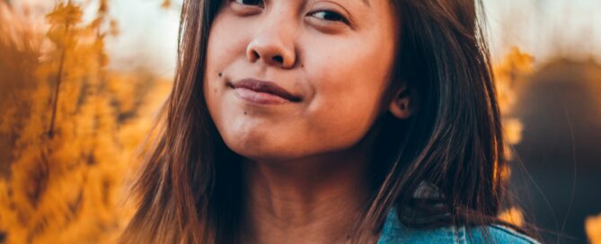 A woman smiles as she thinks of accurate sex language