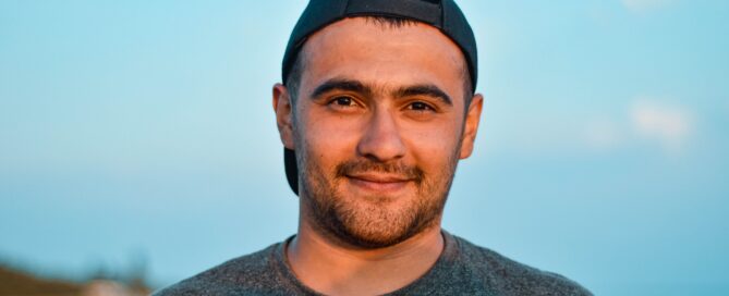 A man with autism smiles at the idea of sex coaching.