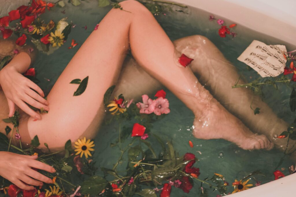 Clearing Your Container: Image shows legs of someone in a tub with flowers