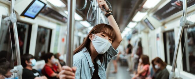 masked woman on the train navigating dating during covid-19 era