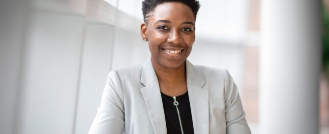 a smiling professional person meeting clients where they are
