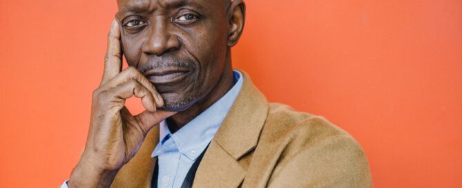 a man with his hand to his face thinking about how to stay online despite internet censorhsip