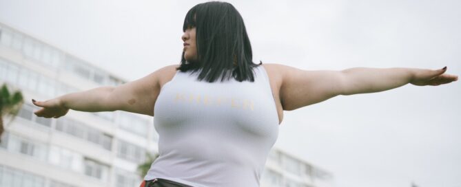 a woman in athletic gear combining fitness training with sex coaching
