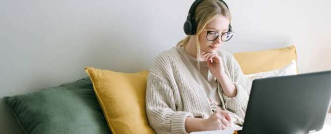 A woman reading about goal oriented sex coaching