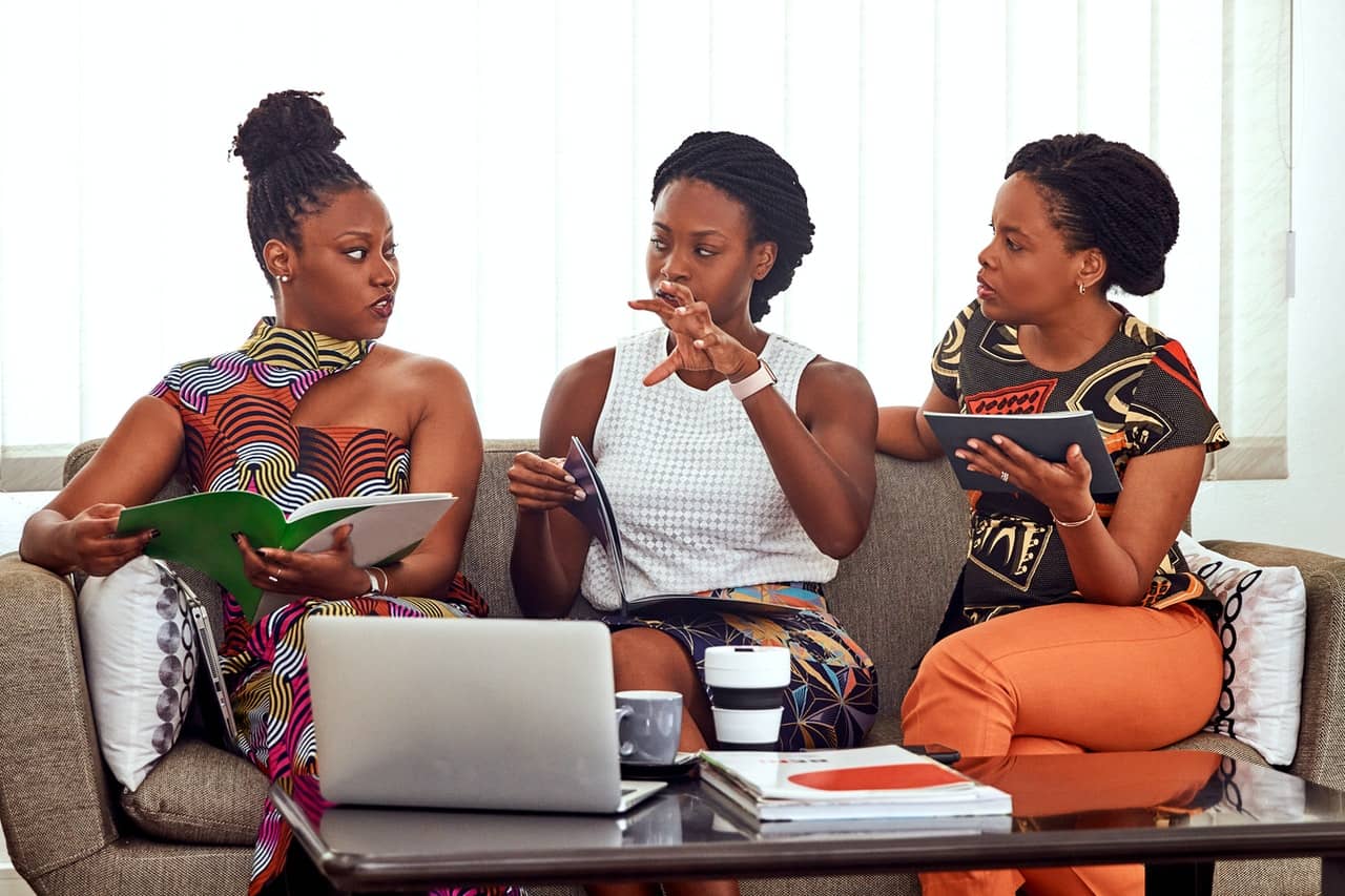 Three entrepreneurs of color discussing their New Year’s resolutions for their business.