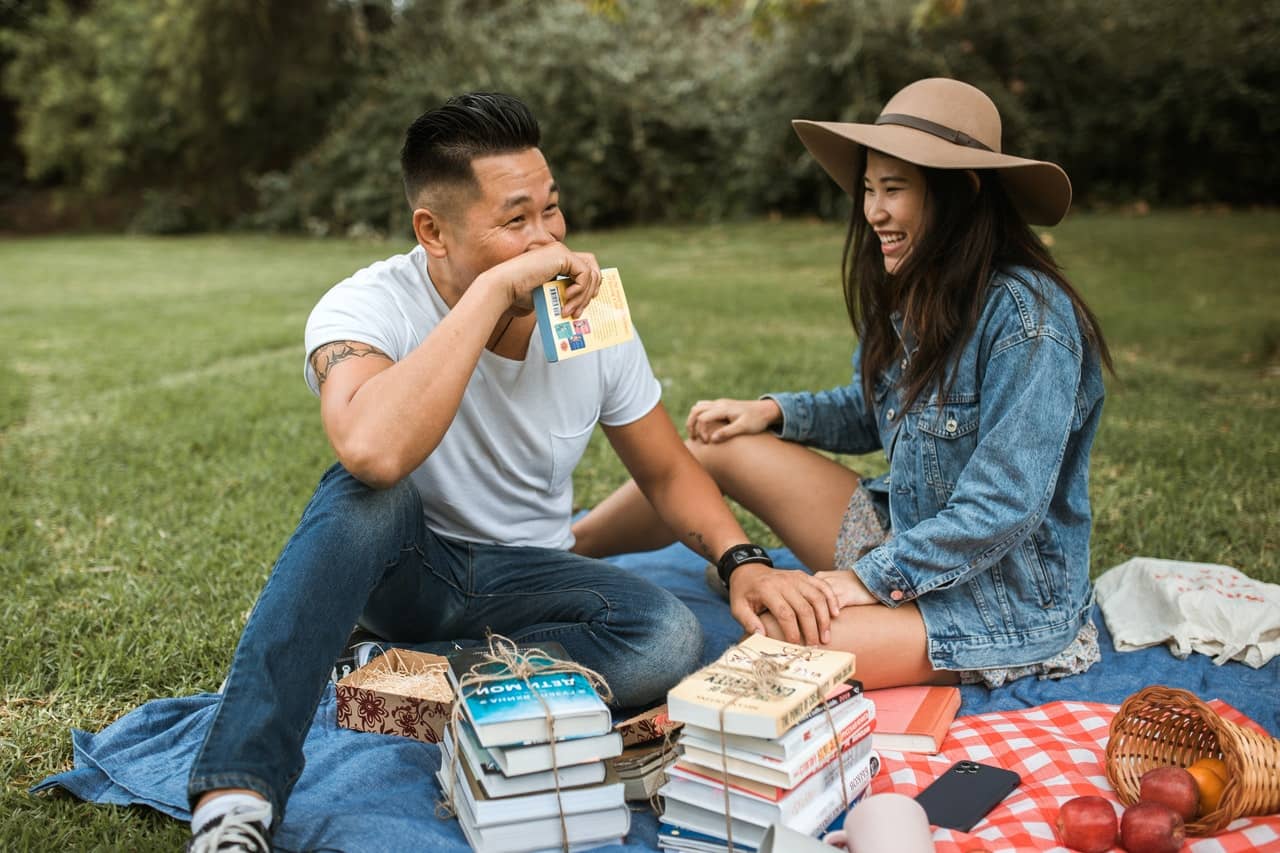 a couple having a picnic after completing Sex coaching assignments for intimacy and connection in couples